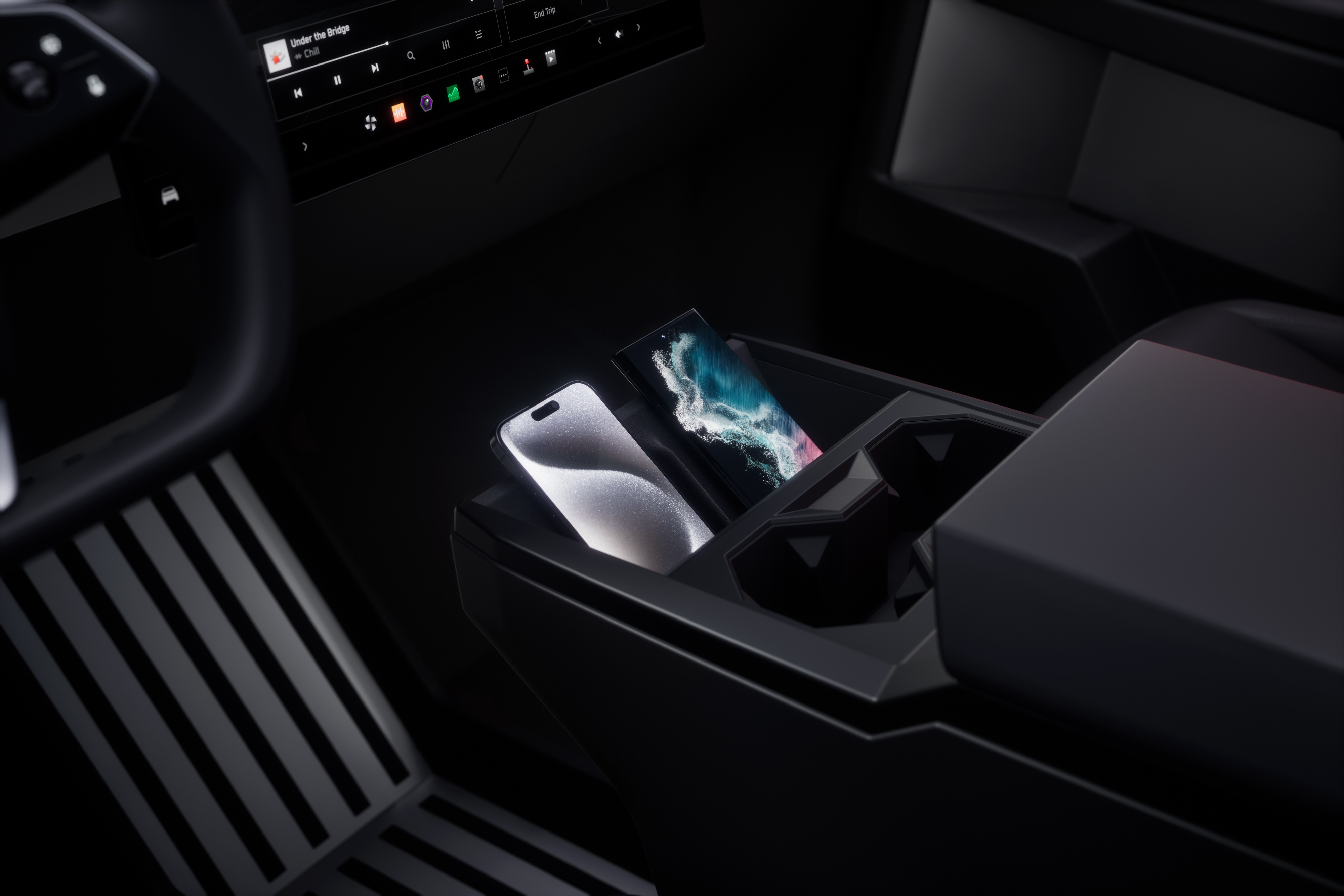 Tesla Cybertrucks mittkonsol, med trådlös laddning och stor skärm, håller dig uppkopplad – även när du lever offline.